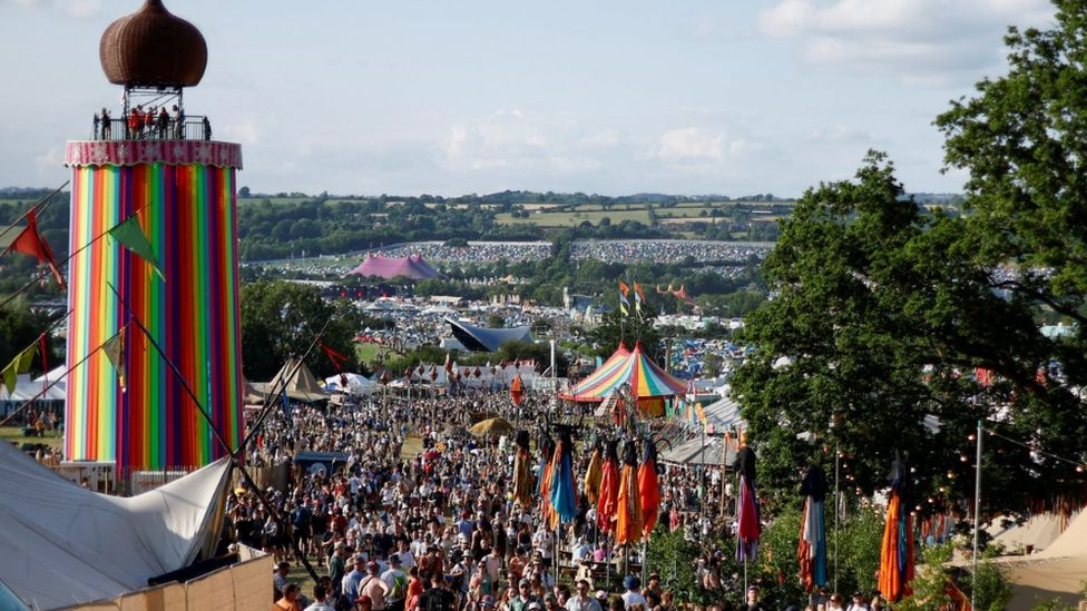 Crowds in front of the Ribbon Tower at Glastonbury Festival