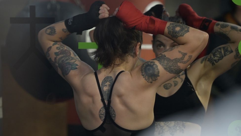 Eilish Tierney, adjusting her hair in the mirror of her gym.