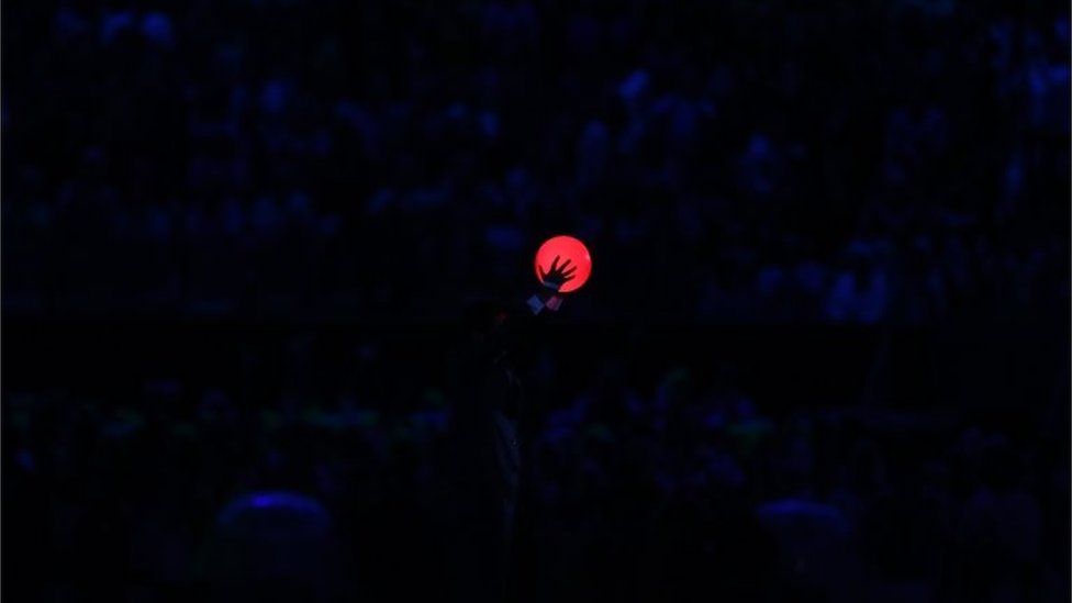 Japanese Prime Minister Shinzo Abe holds up a ball duirng the flag handover segment during the Closing Ceremony on Day 16 of the Rio 2016 Olympic Games at Maracana Stadium on August 21, 2016 in