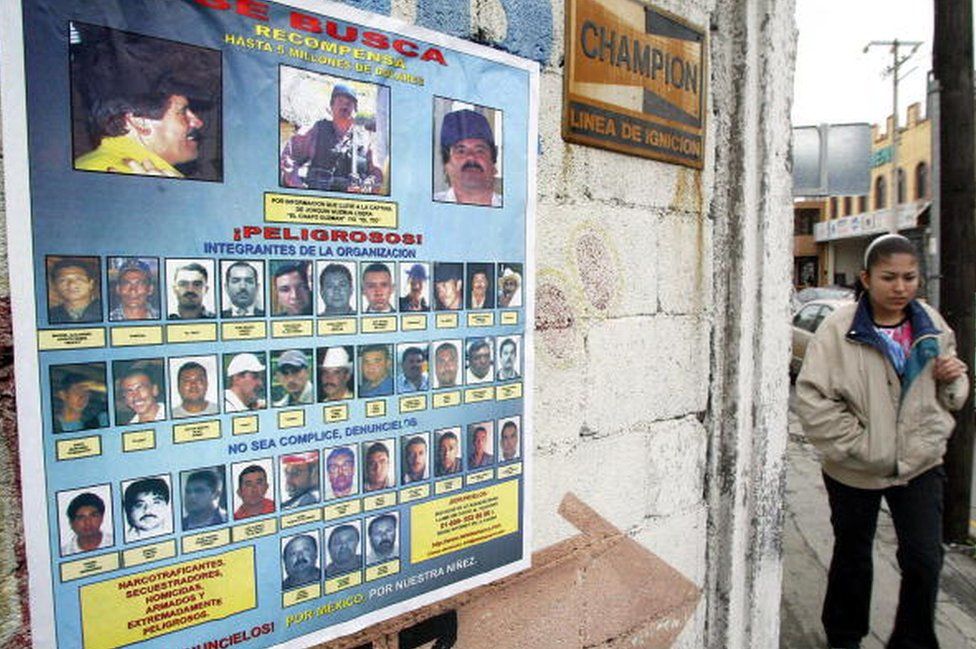 A wanted poster in Monterrey, Mexico features El Chapo at the top
