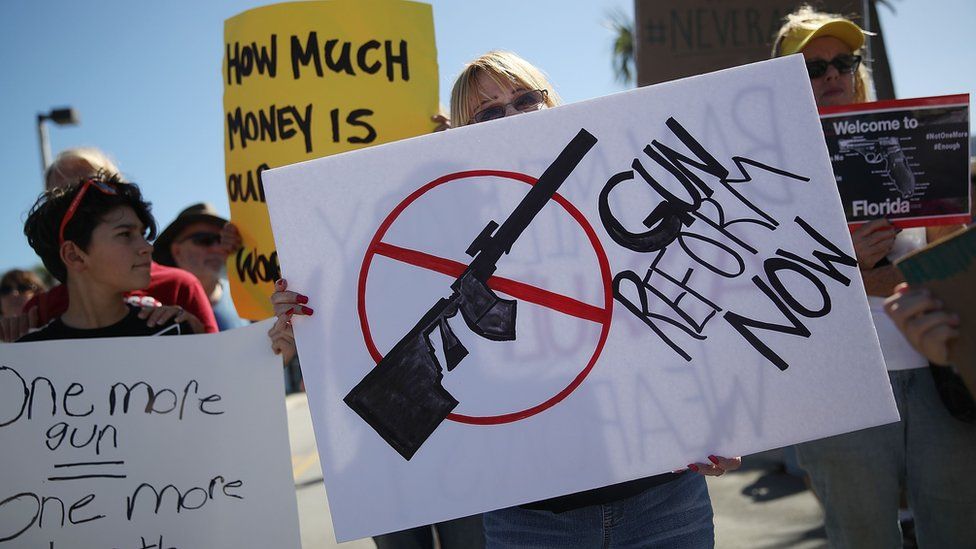 Activists protest in front of Kalashnikov USA, a gun manufacturer that makes an AK-47 rifle, on February 25, 2018 in Pompano Beach, Florida