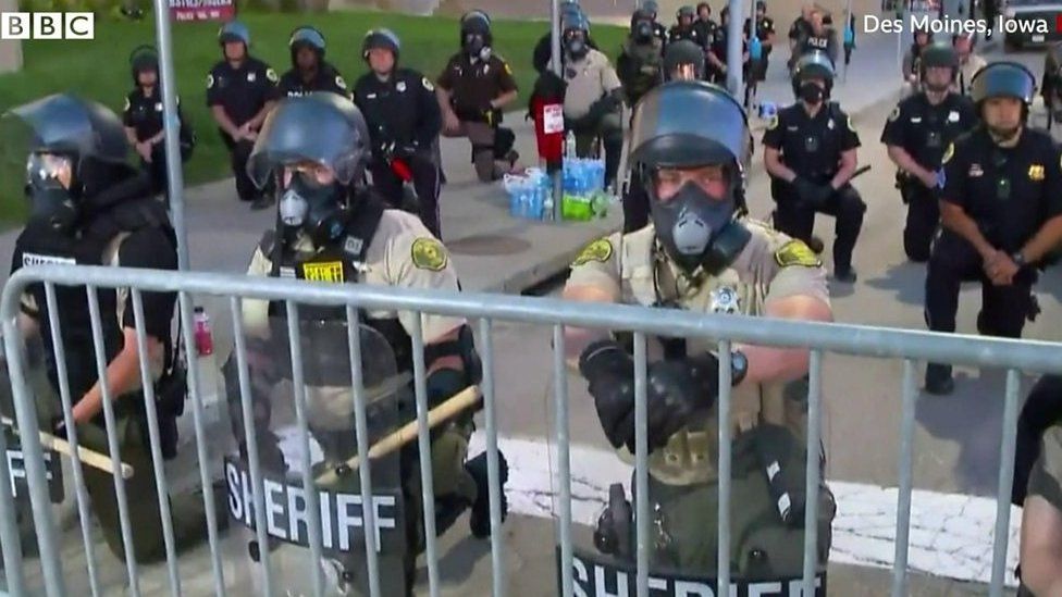 Police kneel in solidarity with protesters
