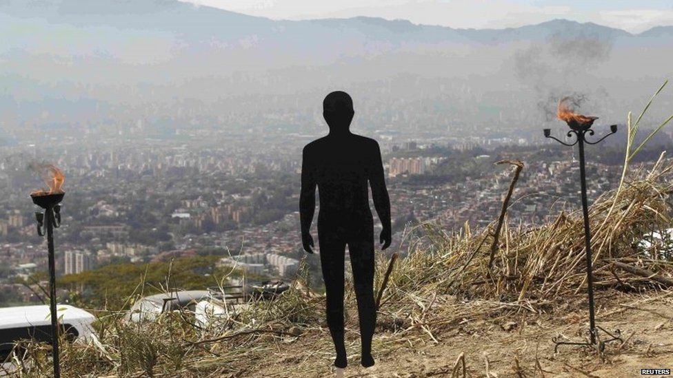 A figure symbolizing missing people is pictured during a ceremony at "La Escombrera" rubbish dump in Medellin.