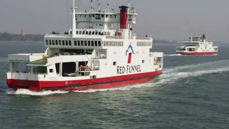 Red Eagle car ferry - which is white with a red base and a Red Funnel logo on the side - sailing across the Solent