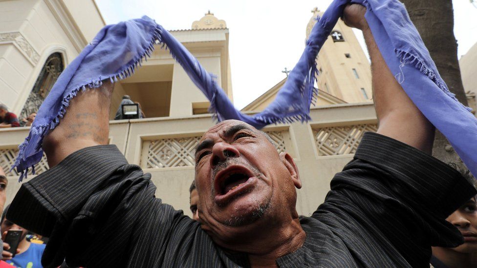 A relative of one of the victims reacts after a church explosion killed at least 21 in Tanta