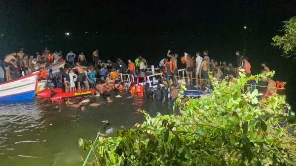 Rescuers search for survivors from the wreckage of a boat in India's Kerala state