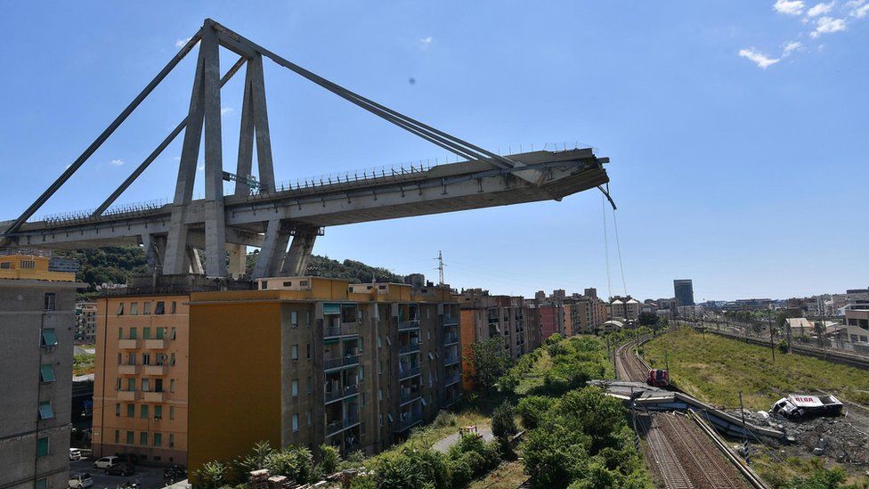 A view of the collapsed Morandi bridge the day after the disaster in Genoa, Italy, 15 August 2018.
