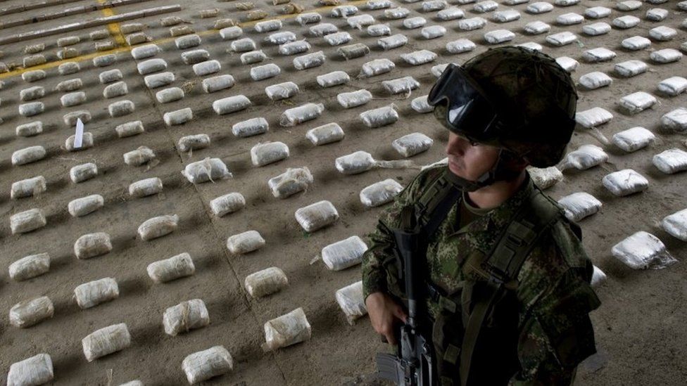 A Colombian soldier with bags of seized cocaine in Choco