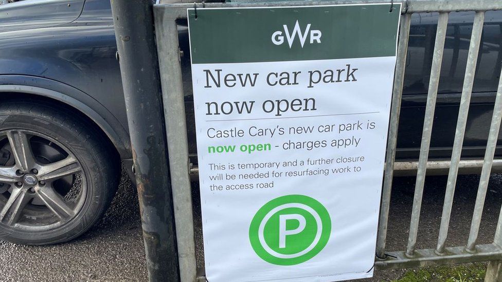 A sign in the Castle Cary car park telling customers the new car park is now open but will soon shut for resurfacing
