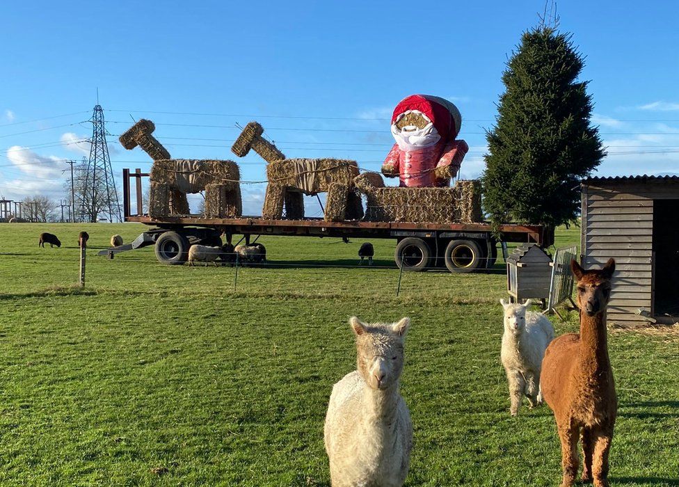 Christmas bale sculpture in 2021 at White Stacks Farm, in Kibworth, Leicestershire