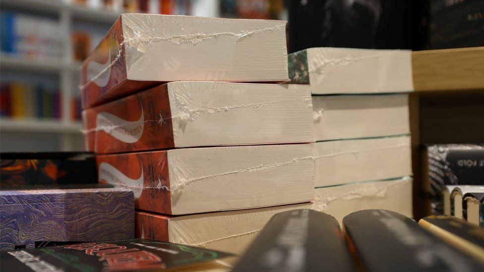 Books that feature LGBTQ+ characters are seen wrapped in foil in a bookstore in Budapest, Hungay