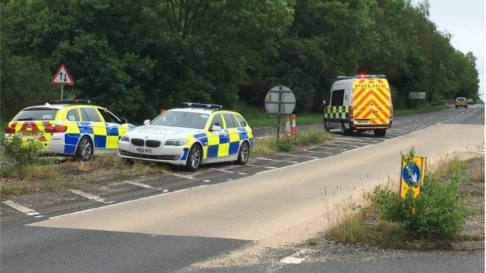Police vehicles on the A33