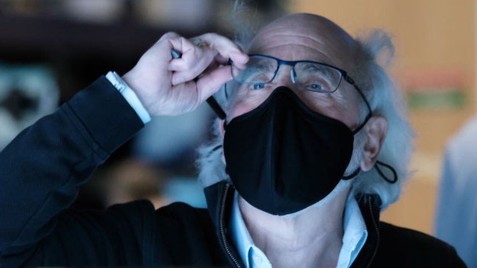 Stock trader Peter Tuchman works on the floor of the New York Stock Exchange in New York City.