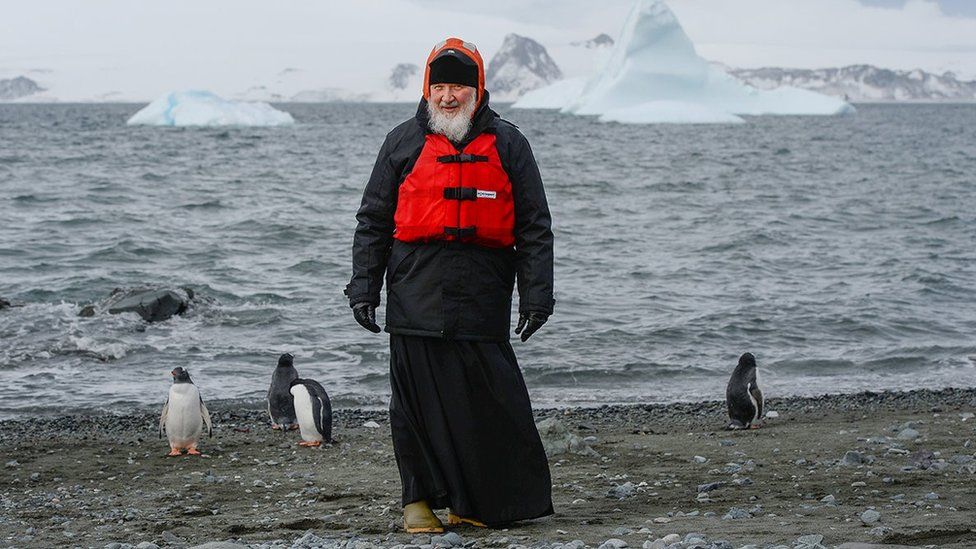 Russian Orthodox Patriarch Kirill is seen near penguins as he visits the Island of Waterloo in the Antarctic, in this handout photo released by Russian patriarchate February 18, 2016