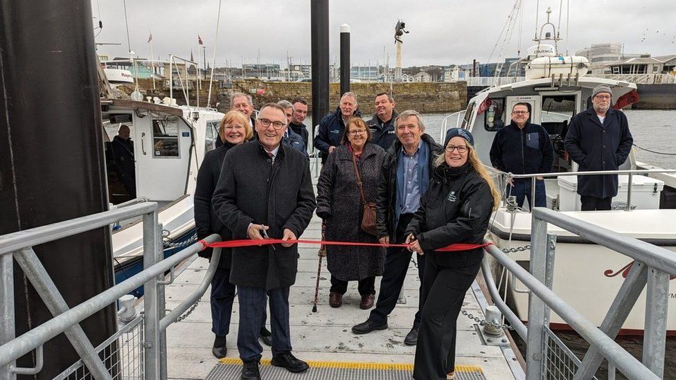 The ribbon being cut at the new Mayflower Pontoons facility in Plymouth
