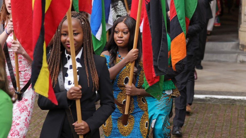 Flag bearers carrying the flags of the Commonwealth at Westminster Abbey during The Commonwealth Day Service on March 14, 2022 in London, England.