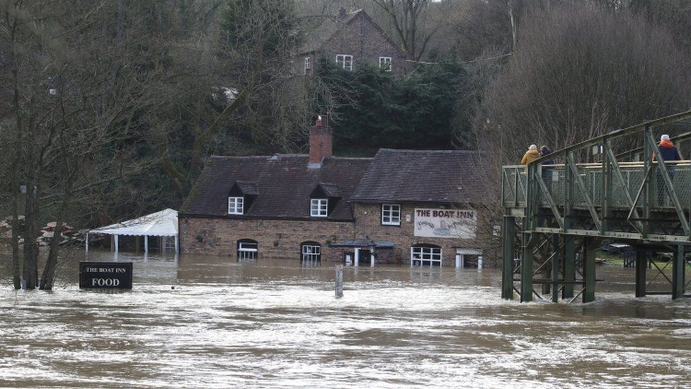 Flood waters from the River Severn surround The Boat Inn at Jackfield near Ironbridge