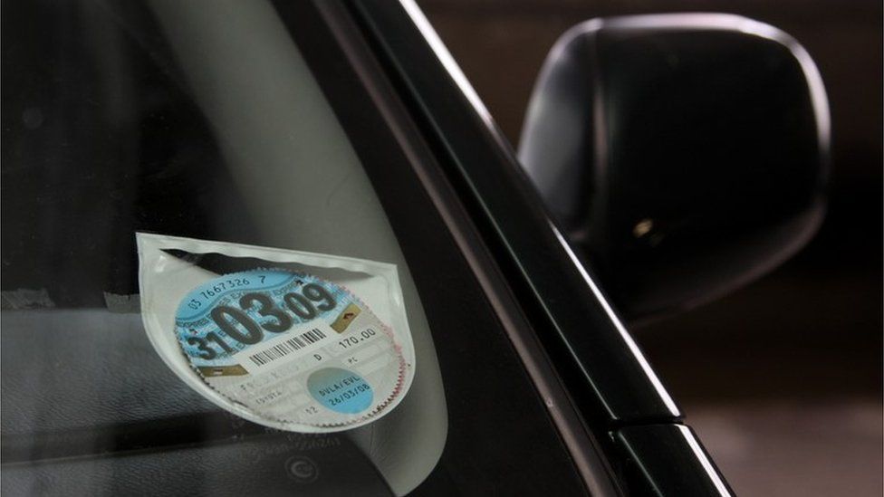 Tax disc in a car windscreen