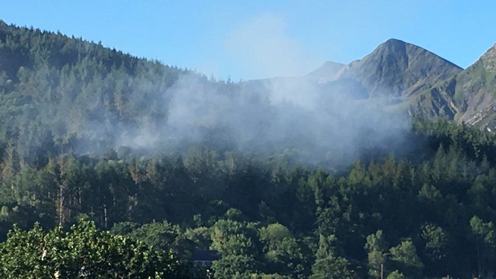 Smoke billows from the forest in Braichmelyn