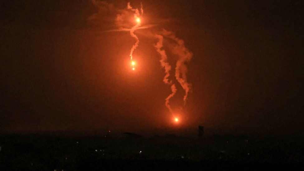 Israeli flares light the sky above Khan Younis in the southern Gaza Strip