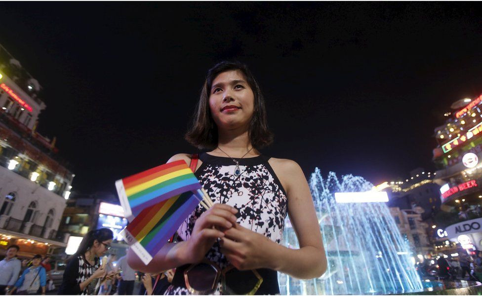 Transgender Anh Phong, 27, who changed her gender from a man to a woman, waits for friends before a LGBT (lesbian, gay, bisexual and transgender) demonstration along a street in Hanoi, Vietnam 24 November 2015.