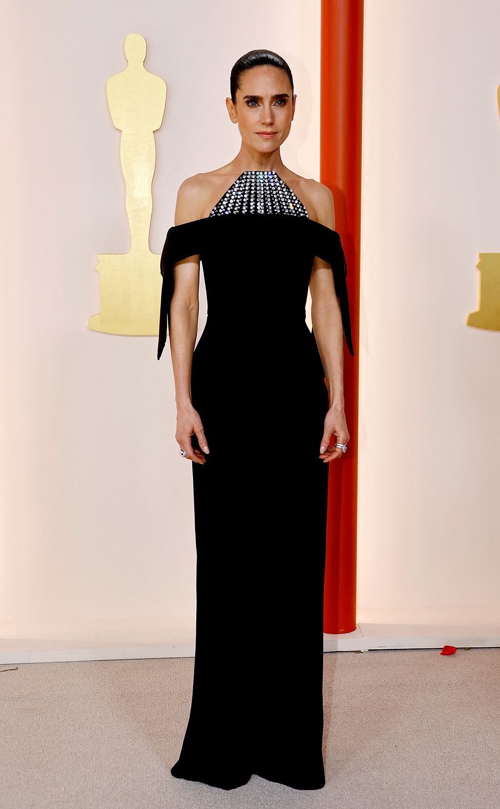 Jennifer Connelly poses on the champagne-colored red carpet during the Oscars arrivals at the 95th Academy Awards in Hollywood, Los Angeles, California, U.S., March 12, 2023