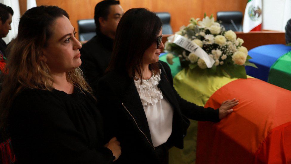People attend a tribute to Mexico's first openly non-binary magistrate and LGBTQ activist, Ociel Baena, and their partner, Dorian Daniel Nieves Herrera, at the Electoral Court of the State of Aguascalientes, in Aguascalientes, Mexico.