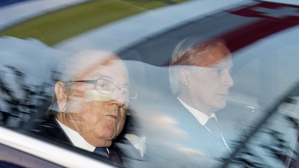 Fifa President Sepp Blatter (left) and his lawyer Lorenz Erni (right) arrive in a car at the Fifa headquarters in Zurich (17 December 2015)