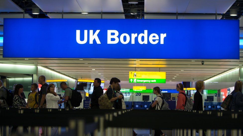 Passengers at Heathrow Airport Terminal 2 UK Border Control