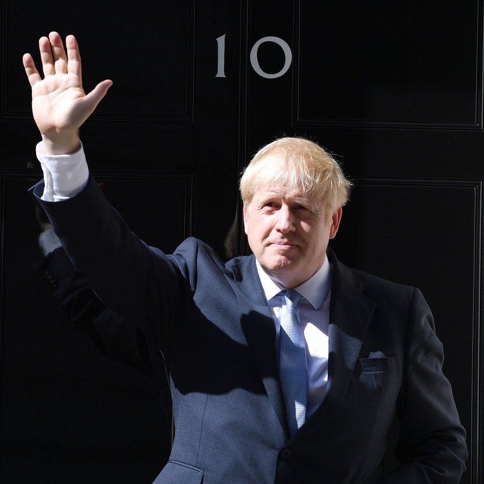 Boris Johnson waves from the door of Number 10, Downing Street after speaking to the media on July 24, 2019