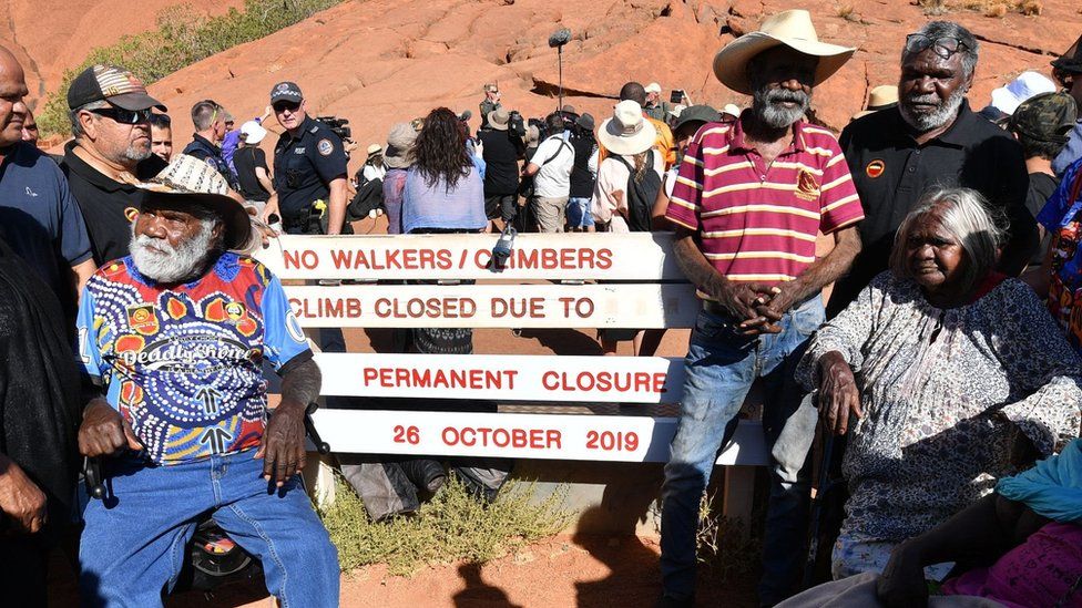 Aboriginal elders gather for a ceremony ahead of a permanent ban on climbing Uluru that comes into place on October 26, at Uluru,