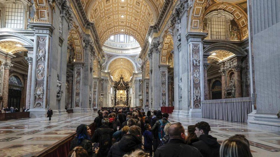 People pay their respects to former Pope Benedict XVI in St Peter's Basilica, Vatican City on 4 January