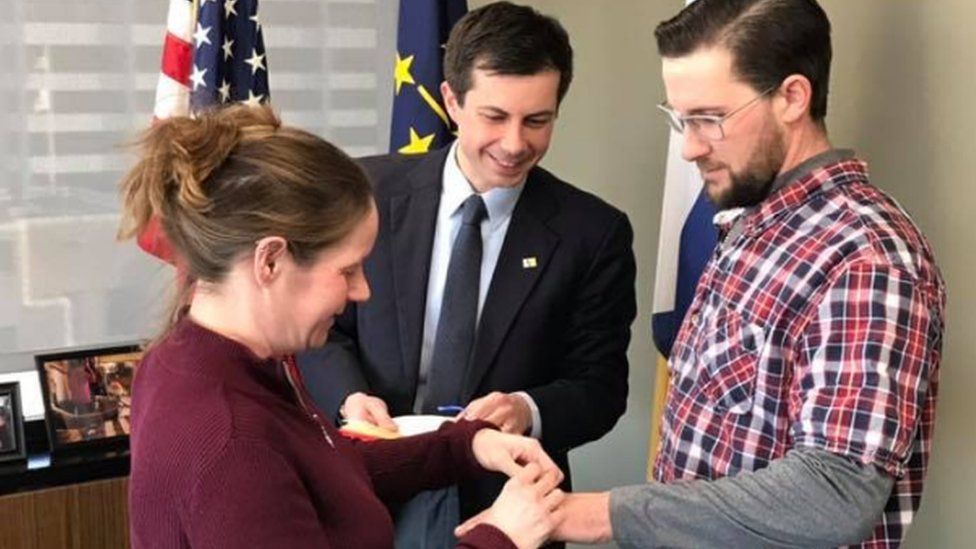 South Bend Mayor Pete Buttigieg (centre) marries Mary and Gabe