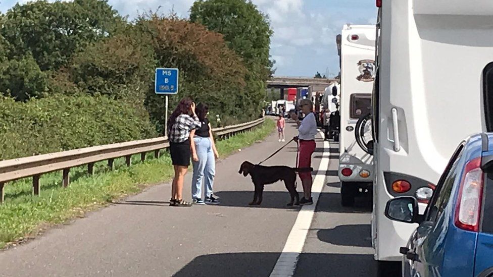 People standing out of their cars on the M5