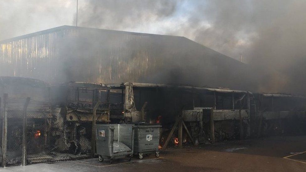Burnt-out coaches at the garage after the fire