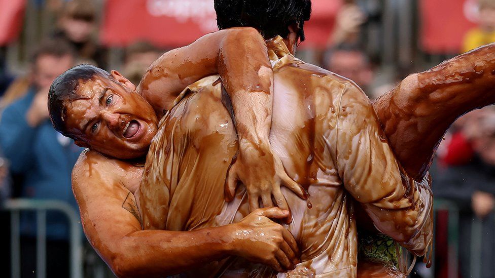 Wrestlers covered in gravy