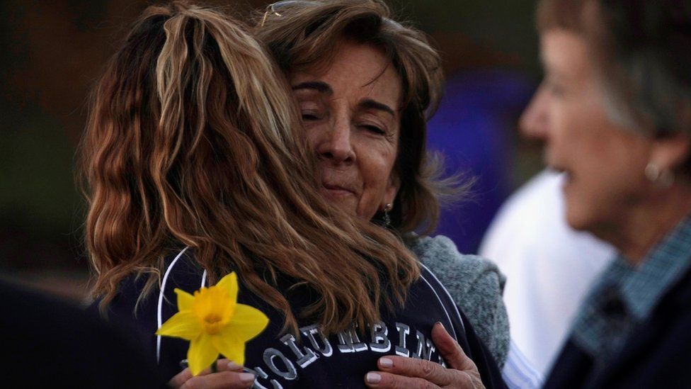 Columbine victim's mother hugs a visitor