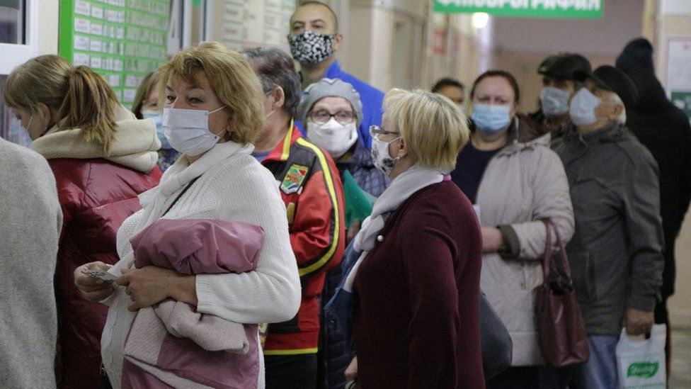 People wait in line at Omsk's City Hospital No 17 in November