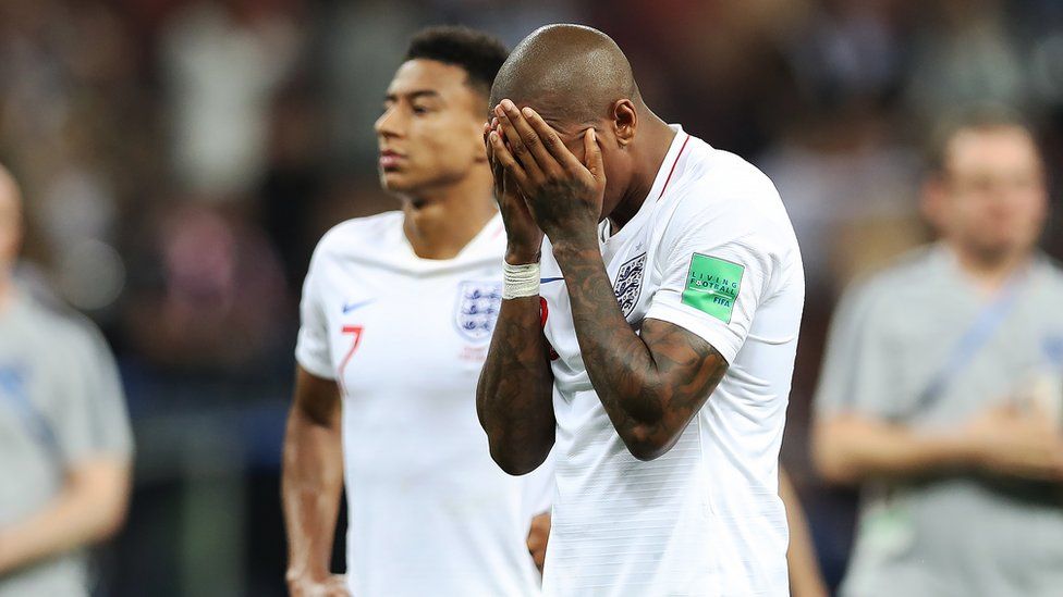 Ashley Young puts his head in his hands while Jesse Lingard looks on sad