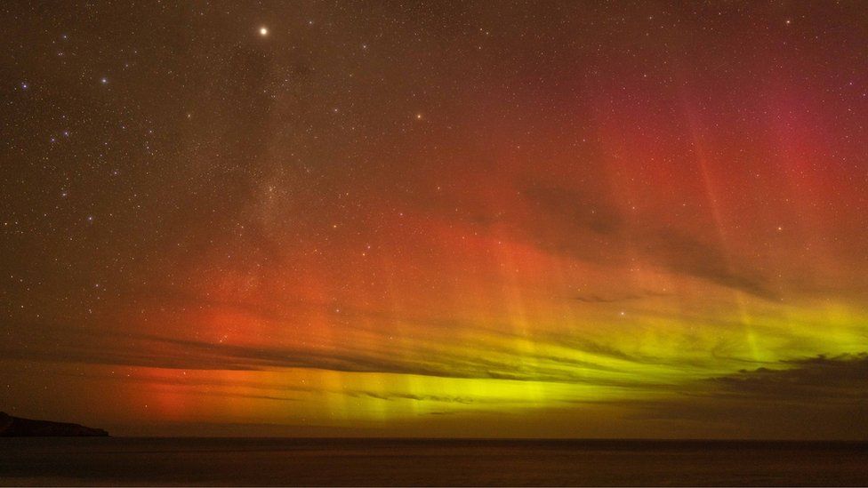 Yellow and orange Southern Lights over Christchurch New Zealand.