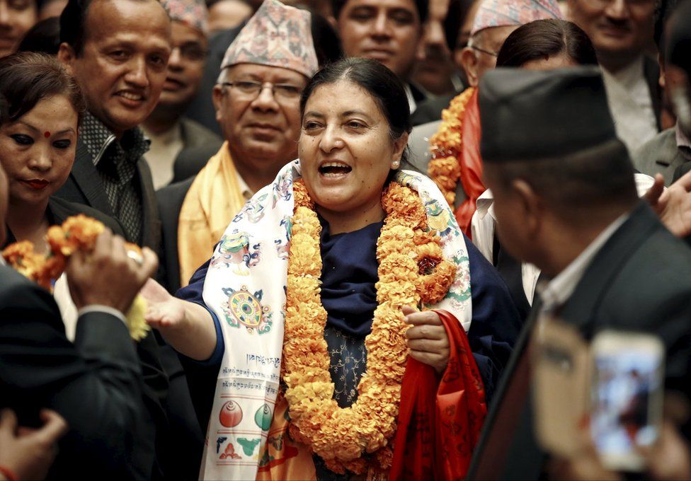 Nepal's newly elected President Bidhya Bhandari (C) walks out from the parliament after she was elected to power in Kathmandu, Nepal 28 October 2015.