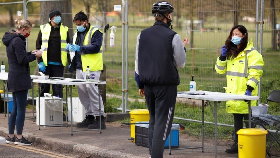 People take coronavirus tests on Clapham Common in London
