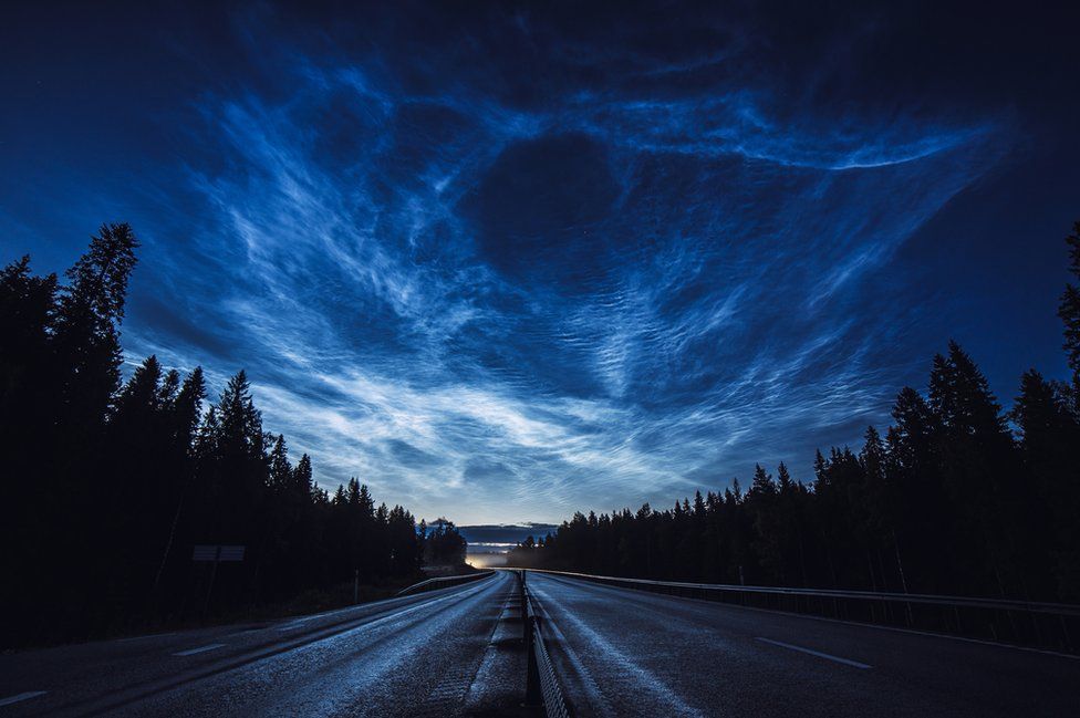 Noctilucent clouds stretch across the Swedish sky