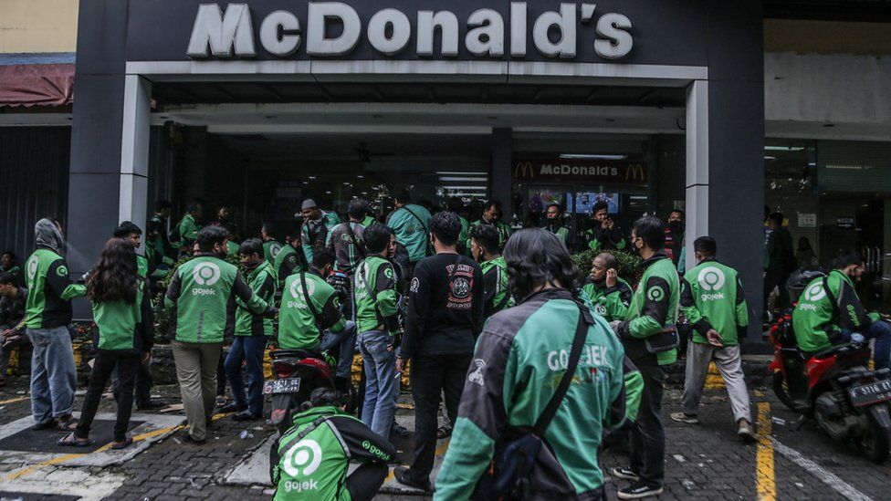 Delivery drivers outside a branch of McDonalds in Indonesia