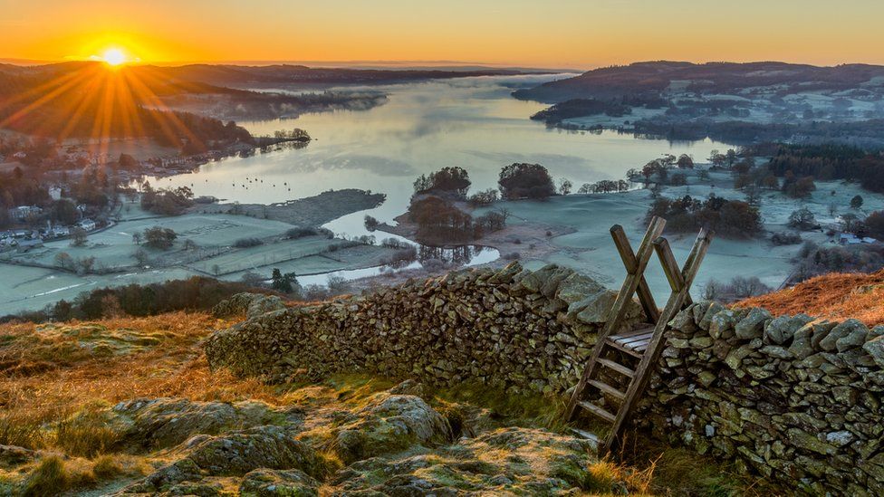 View of Windermere in frost and rising sun