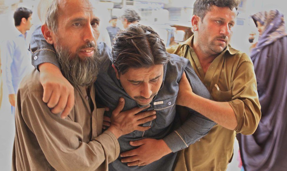 A man who was injured in an earthquake is rushed for medical treatment at a hospital in Peshawar, Pakistan, 10 April 2016