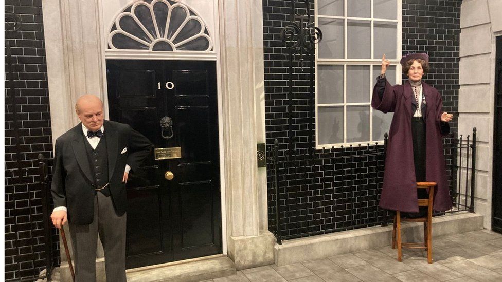 Emmeline Pankhurst standing on a chair outside no10