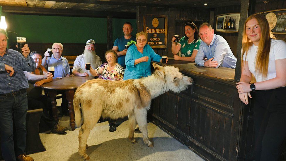Luke Fee in JJ Devine's reconstructed pub with family and friends Photo courtesy of Galway Advertiser