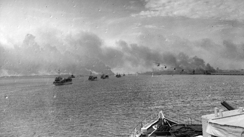 British helicopters flying over landing craft approaching Port Said during the Suez Crisis