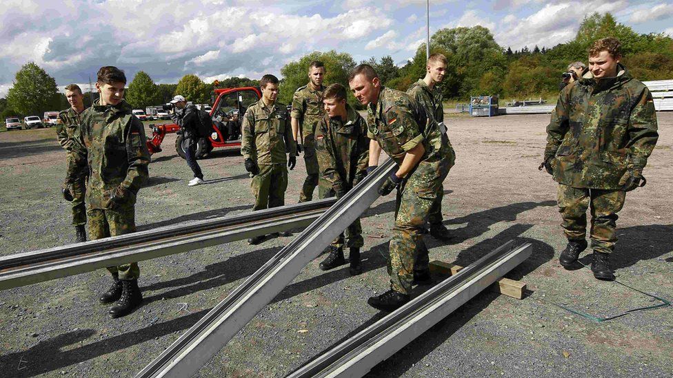 Hanau, Germany - army builds tent for migrants, 14 Sep 15